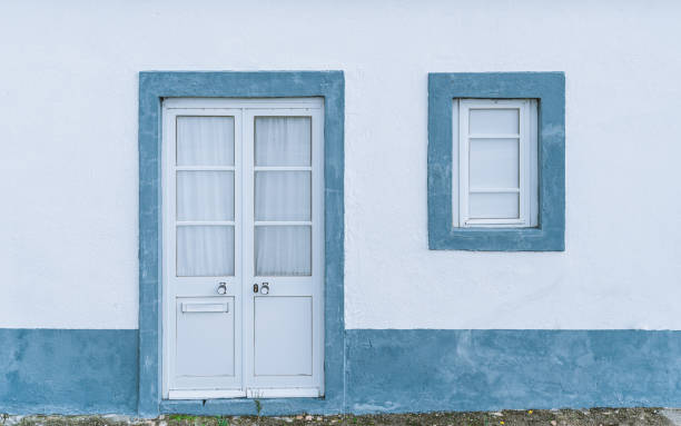 neat traditional facade in portugal - door curtain imagens e fotografias de stock