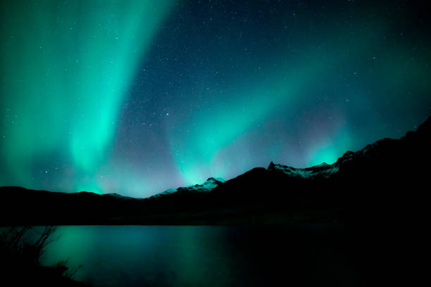 istock Aurora above mountain landscape 1154801730