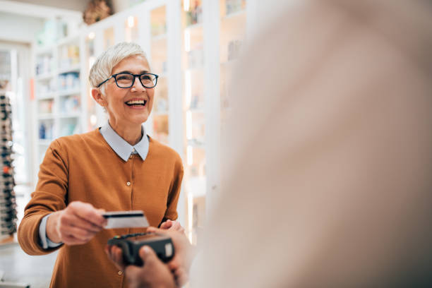 istock Woman paying with credit card 1154803399