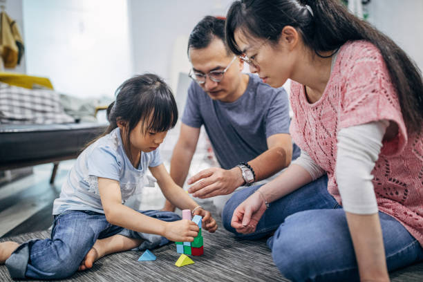 istock Happy family playing with toys 1154803652