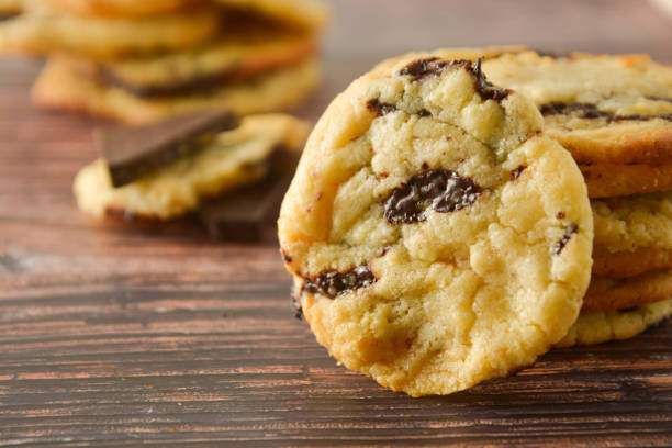 istock Homemade chocolate cookies on wooden table. 1154804461