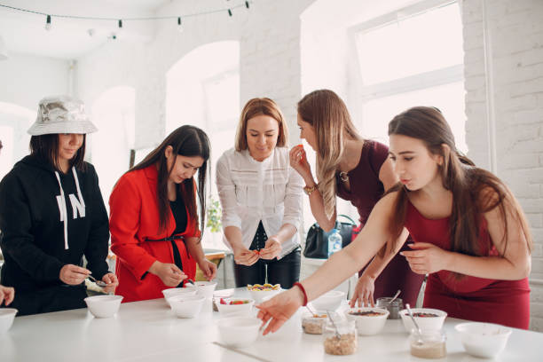 istock Healthy Food Master Class. Cooking Course. Nutritionist and students. 1154804525