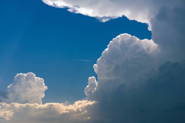 Tinted, big and fluffy cumulonimbus storm clouds stock photo