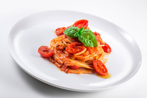 istock Plate of spaghetti with tomato and basil 1154805255