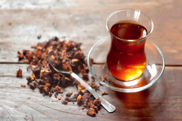 istock Turkish tea in traditional glass on wooden background. Selective focus. 1154806465