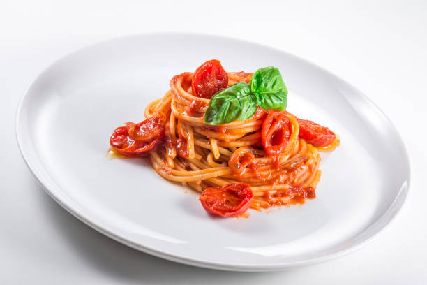 istock Plate of spaghetti with tomato and basil 1154807586