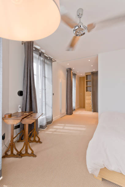 istock Cozy  bedroom with walk in wardrobe 1154810483