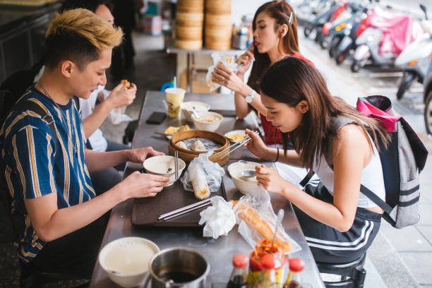 istock Happy young group Enjoying Taiwanese Breakfast 1154813088