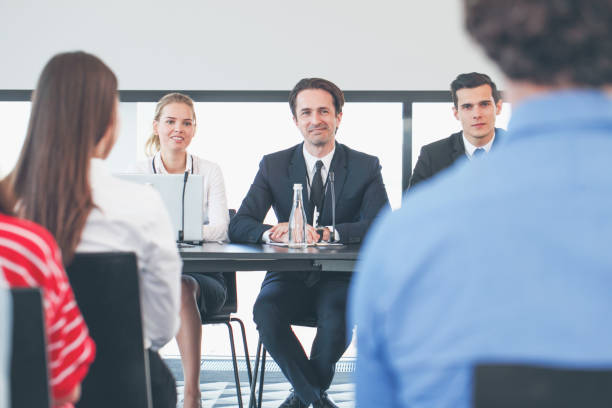 istock Speakers at business meeting 1154813187