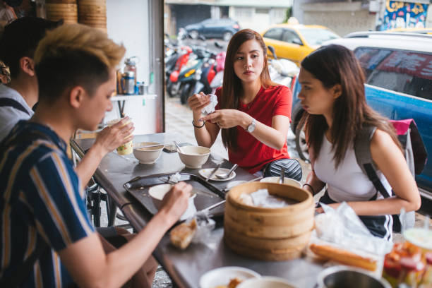 istock Happy young group Enjoying Taiwanese Breakfast 1154813272