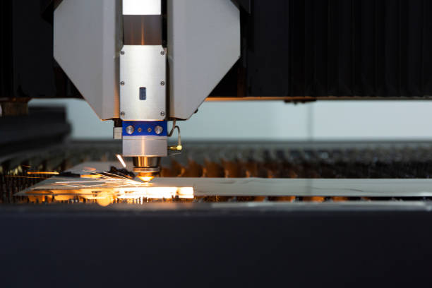 istock Laser cutting of metal sheet with sparks 1154816464