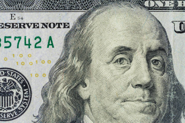 istock Close up of new hundred dollar bill. 1154817445