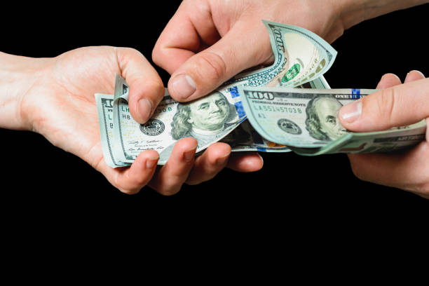 istock Payment of services, receiving bribes, exchange for information, Dollar bills. 1154818058