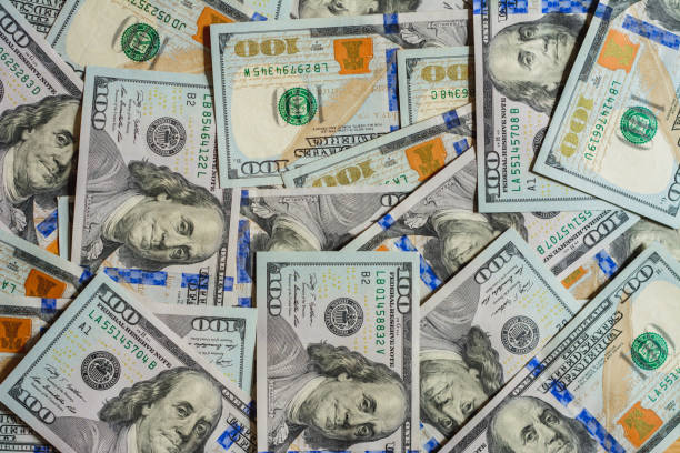 istock The American one hundred dollar denomination is a close-up chaotic texture. 1154818679