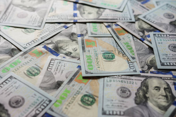 istock US dollars in one hundred banknotes, cash texture. 1154818690