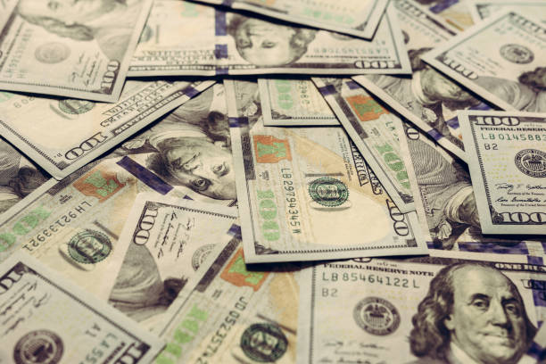 istock US dollars in one hundred banknotes, cash texture. 1154818713