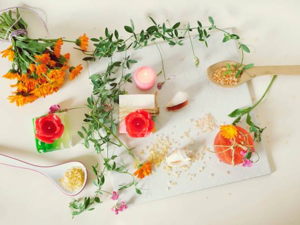 istock Natural soap, candles, sea salt, flowers, shells on a light background 1154819315