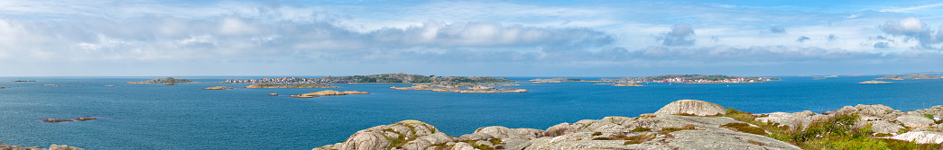 Panorama over the islands in Gothenburg northern archipelago in Sweden. Photo is shot from the island of Kallo-Knippla. Island to the left is Hyppeln and to the right is Roro. Fortress on the island Marstrand is visible at the horizon to the right.