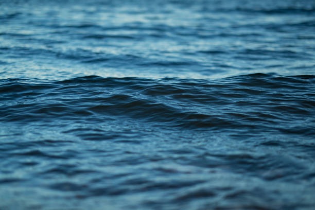 istock Closeup surface of  wavy ocean blue sea water. Abstract Background Texture. 1154822385