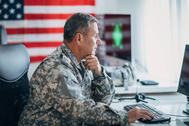 istock Senior soldier working at the office 1154822404