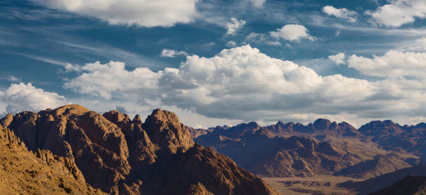 istock Beautiful view from the mountain. Panorama. Mountain range with visible silhouettes through the morning blue fog 1154823140