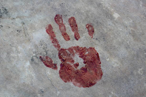 Childs hand and memorable handprint in concrete