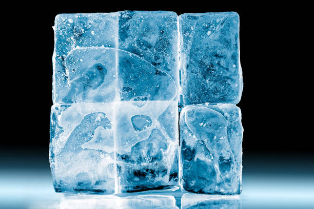 istock Textured frosty ice blocks isolated on black background. 1154824658