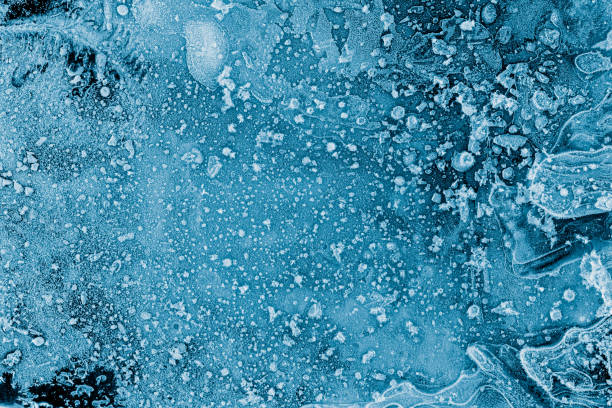 istock Ice texture background. Textured frosty surface of ice blocks against black. 1154824659