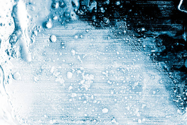 Ice texture background. Textured frosty surface of ice blocks against black.