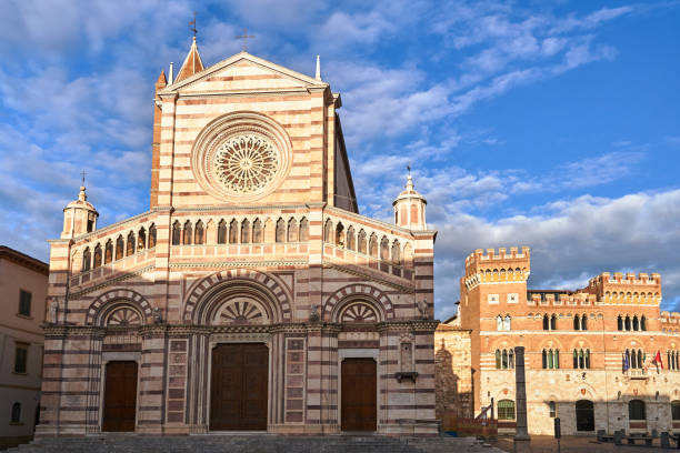 фасад исторического собора и здание ратуши в городе гроссето - grosseto province стоковые фото и изображения