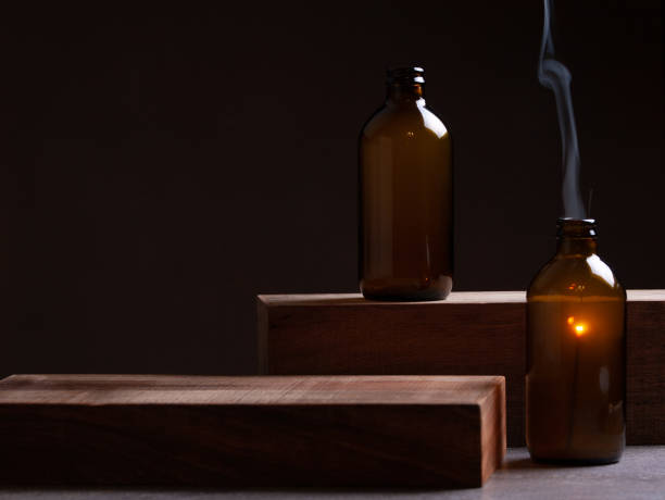 istock Bottles And Sparkler On Dark Moody Background. 1154825343