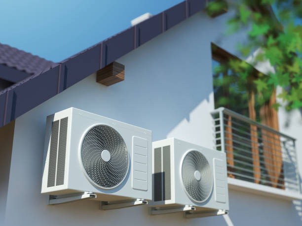 istock Two Air compressors on house 1154825345