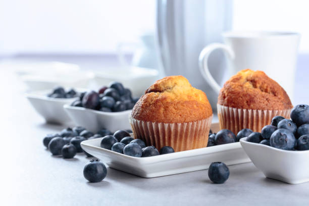 istock Muffins and blueberry on white table. 1154825645