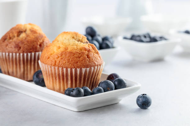 istock Muffins and blueberry on white table. 1154825658