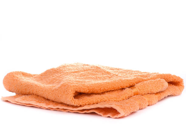 istock Orange terry towel isolated on a white background. 1154826475