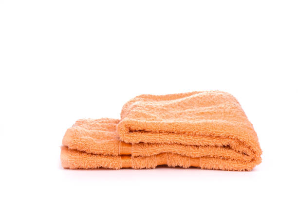istock Orange terry towel isolated on a white background. 1154826504