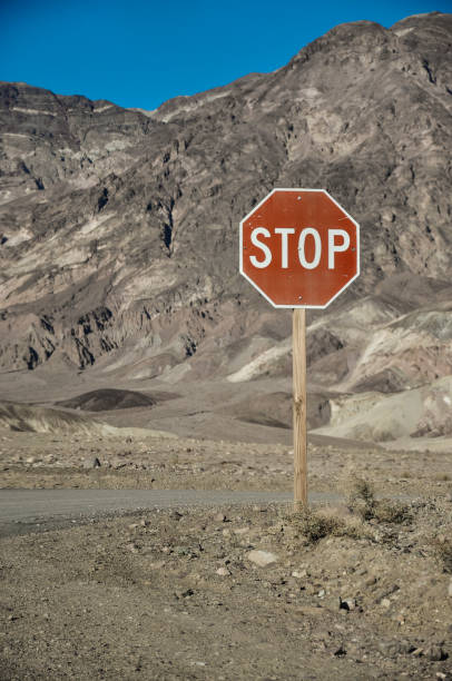istock Stop sign in the desert 1154826970