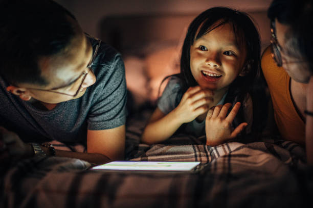 istock Family watching cartoons 1154826980