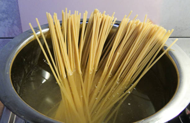 istock Spaghetti in pan cooking, salt water 1154827727