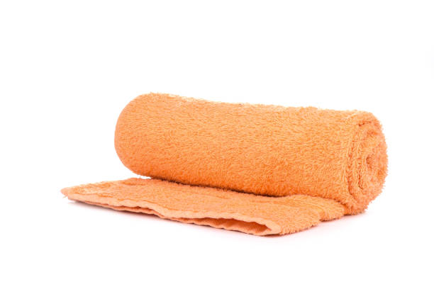 istock Orange terry towel isolated on a white background. 1154828685