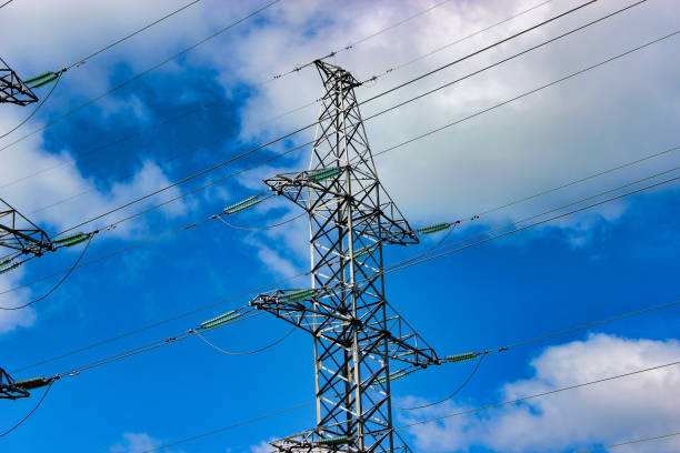istock High-voltage power line against the sky close-up. Cable industry. 1154830619