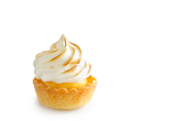 istock Mini lemon meringue tart isolated on white background 1154833490