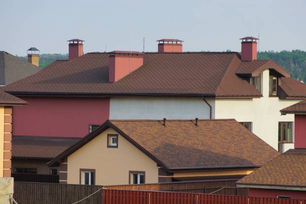 istock private houses with brown tiled roofs 1154833905