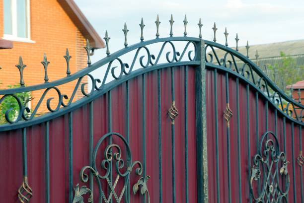 istock part of a red metal gate with a black forged pattern 1154835371