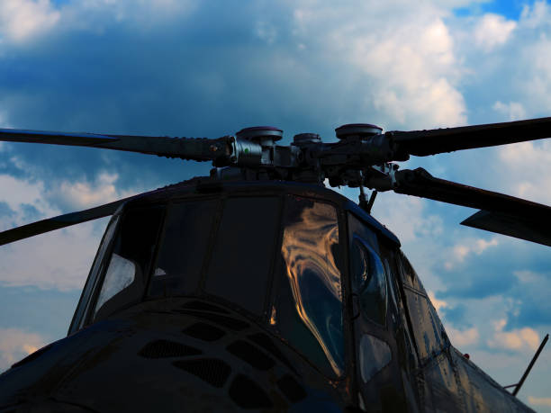istock Military helicopter during daylight background 1154838132
