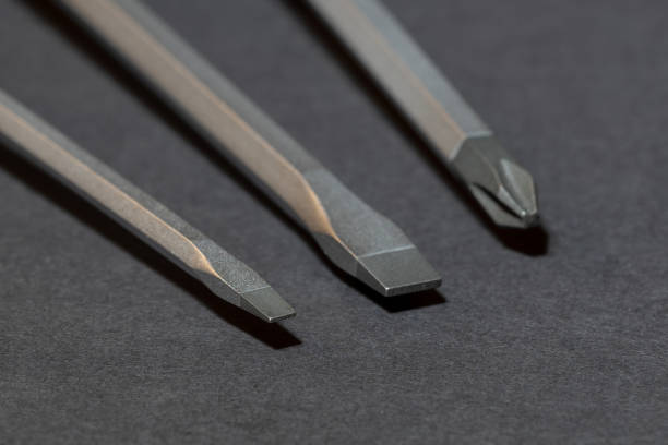 istock Slotted Pozidriv Philips Screwdrivers on Black Background - Hexagon Shaped 1154843008
