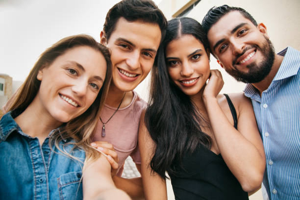 istock Diverse young and cute friends smiling at camera 1154844117