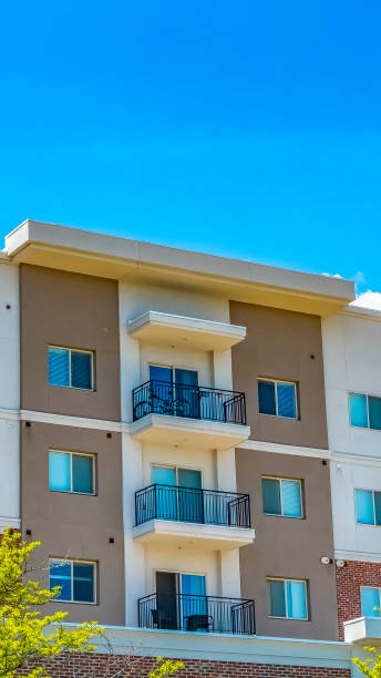 istock Panorama Residential building featuring red brick exterior wall and small balconies 1154845075