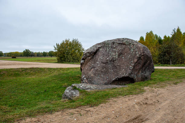 istock large rock in sand in countryside 1154845556
