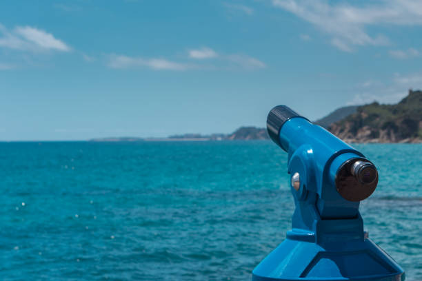 istock Blue telescope - panoramic binoculars for tourists with sea view 1154847159